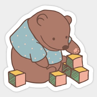 Little teddy bear plays with toys on a baby onzie or sweatshirt Sticker